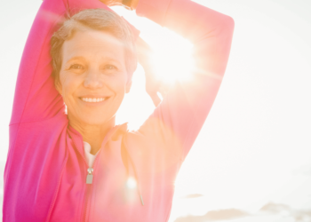 smiling sporty woman streching jpg